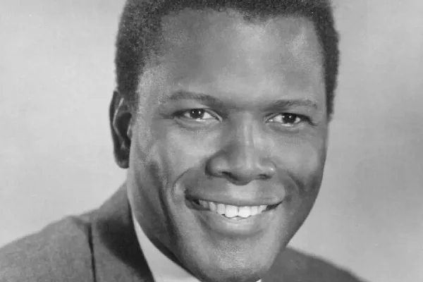 Black-and-white portrait of Sidney Poitier in a classic studio setting