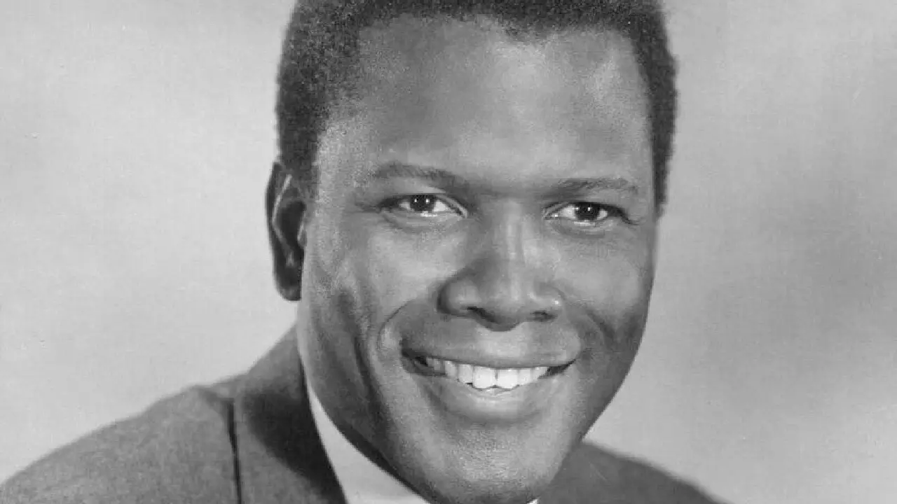 Black-and-white portrait of Sidney Poitier in a classic studio setting